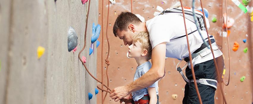 Father helping son with rockwall.